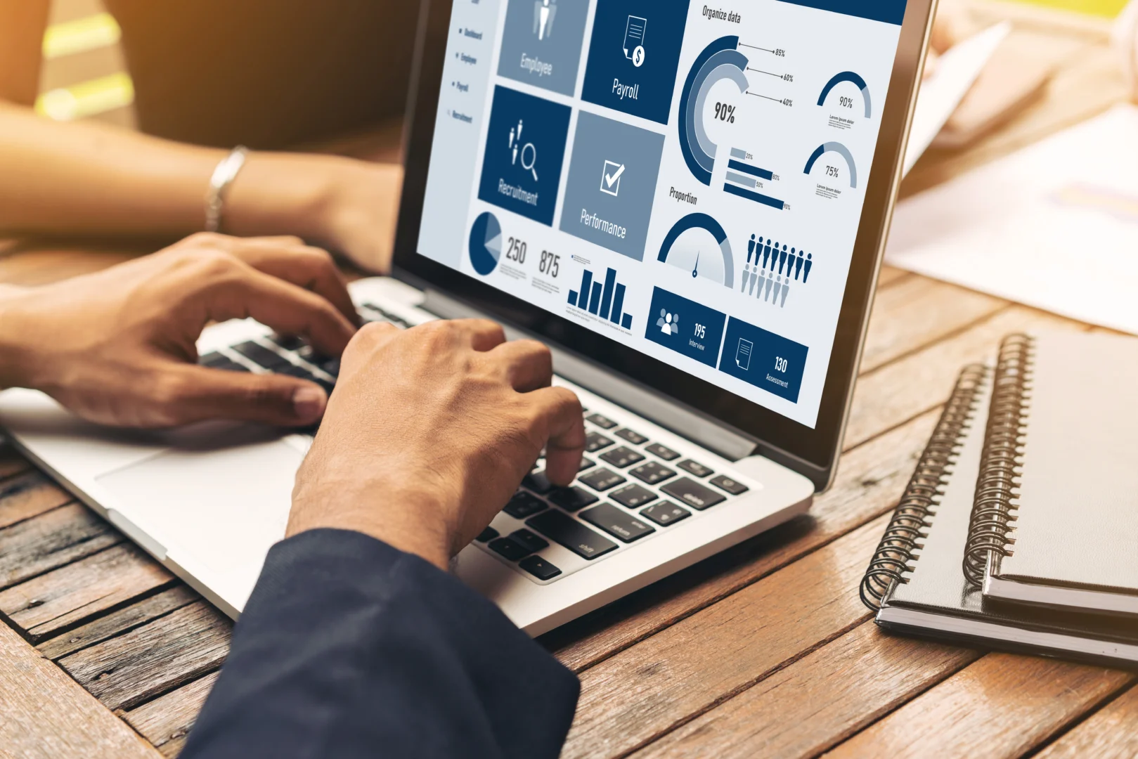 Person tracking HR Documents on Laptop